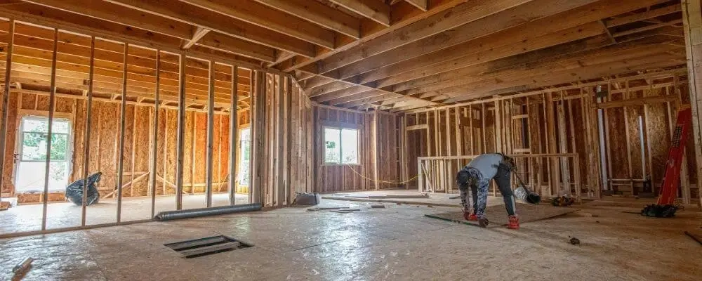 Framed home under construction in Northern Kentucky showing a builder working on-site